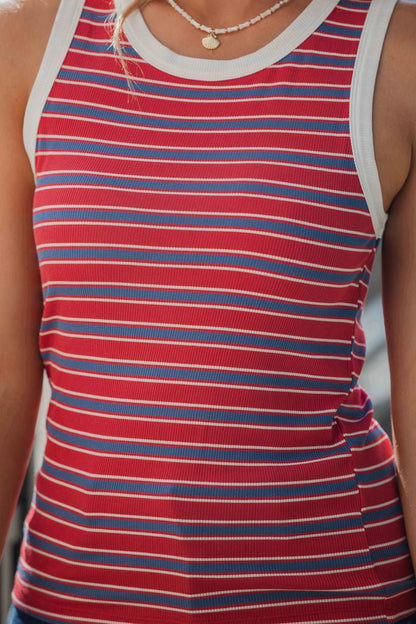 A person in the All-Day Stripe Tank Top - Red-FINAL SALE, styled with a necklace featuring a small round pendant.