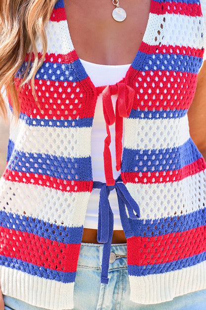 Model in Stars & Stripes Tie Front Sweater Vest over white tank and light blue jeans.