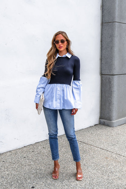 Woman in sunglasses, Steve Madden Lenny Top - Navy, jeans, clear heels, with a textured white clutch against a white wall.