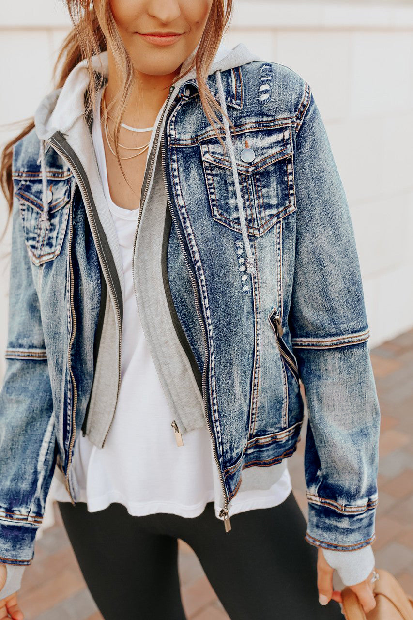 Woman outdoors in a Denim Jacket with Hoodie: Medium Wash over a white tee and black leggings.