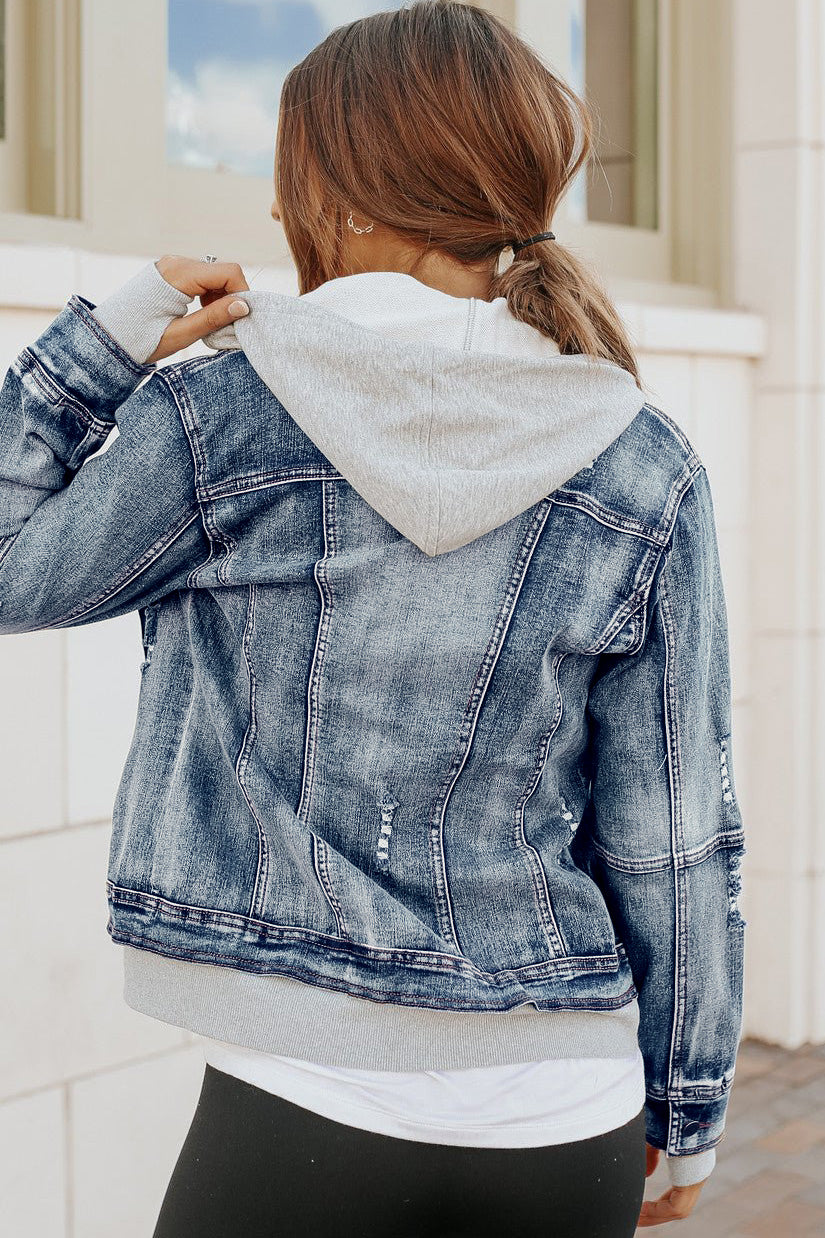 Woman with brown hair wears the Denim Jacket with Hoodie: Medium Wash, standing outside facing away from the camera.