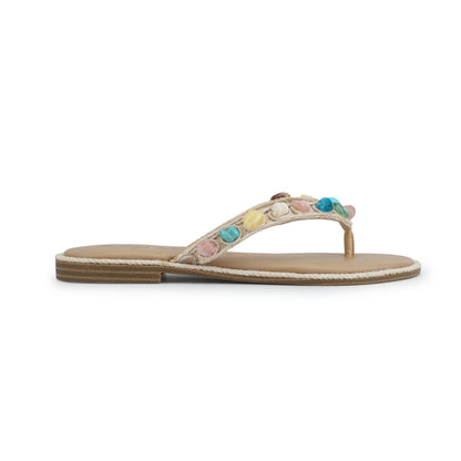 The Vintage Havana Sandy Beige Gemstone Flip Flops feature a flat tan thong strap with multicolored gems and a low wooden heel.