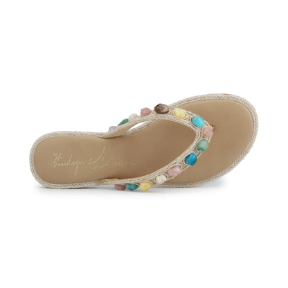 Vintage Havana Sandy Beige Gemstone Flip Flops feature multicolored gems and logo on the insole for a chic, playful finish.